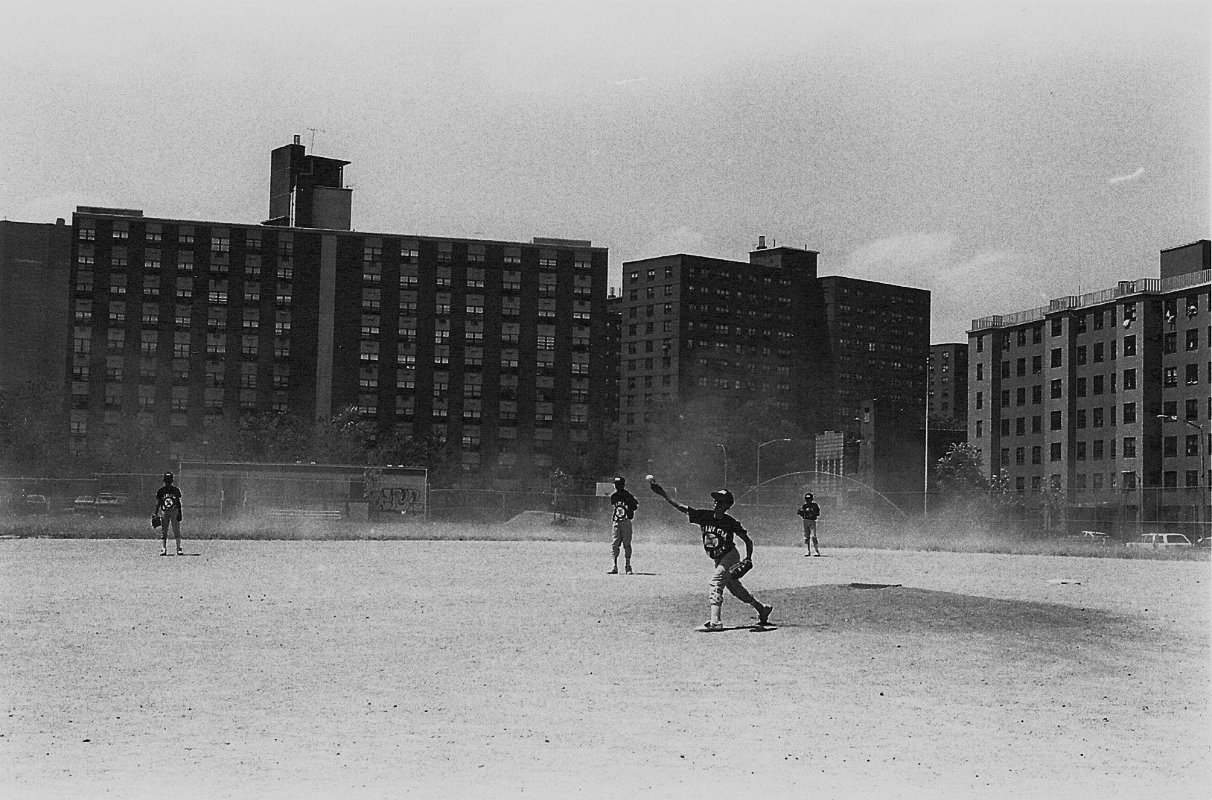Photograph of kids playing baseball on the Harlem RBI field